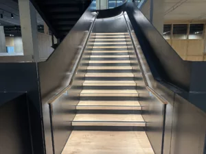 London College of Fashion, Stratford Waterfront | bespoke timber LED handrail | The Light Lab