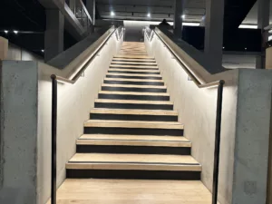 London College of Fashion, Stratford Waterfront | bespoke timber LED handrail | The Light Lab
