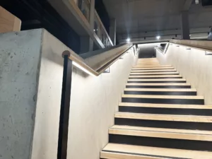 London College of Fashion, Stratford Waterfront | bespoke timber LED handrail | The Light Lab