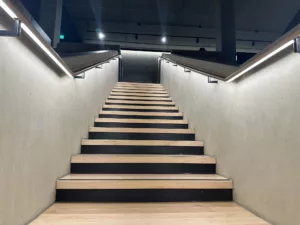 London College of Fashion, Stratford Waterfront | bespoke timber LED handrail | The Light Lab