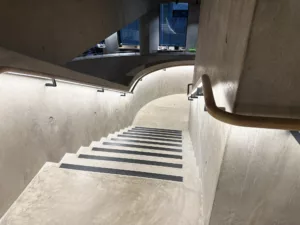 London College of Fashion, Stratford Waterfront | bespoke timber LED handrail | The Light Lab
