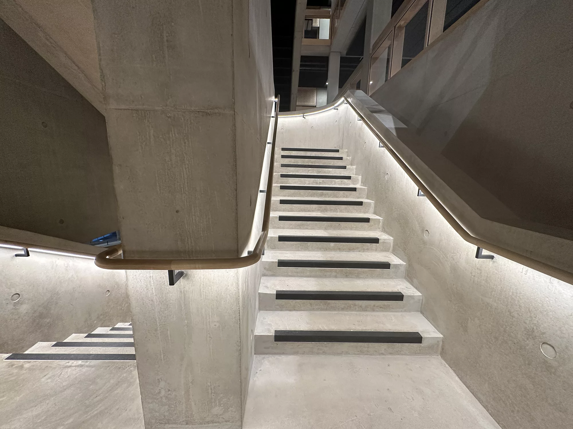 London College of Fashion, Stratford Waterfront | bespoke timber LED handrail | The Light Lab