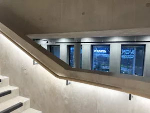 London College of Fashion, Stratford Waterfront | bespoke timber LED handrail | The Light Lab