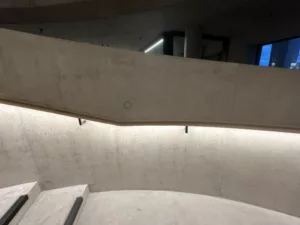 London College of Fashion, Stratford Waterfront | bespoke timber LED handrail | The Light Lab